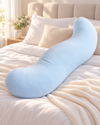 Blue Snuggi Body Align full body pillow on bed